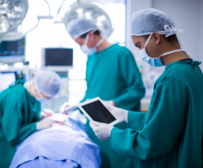 Surgeon using digital tablet operation theater